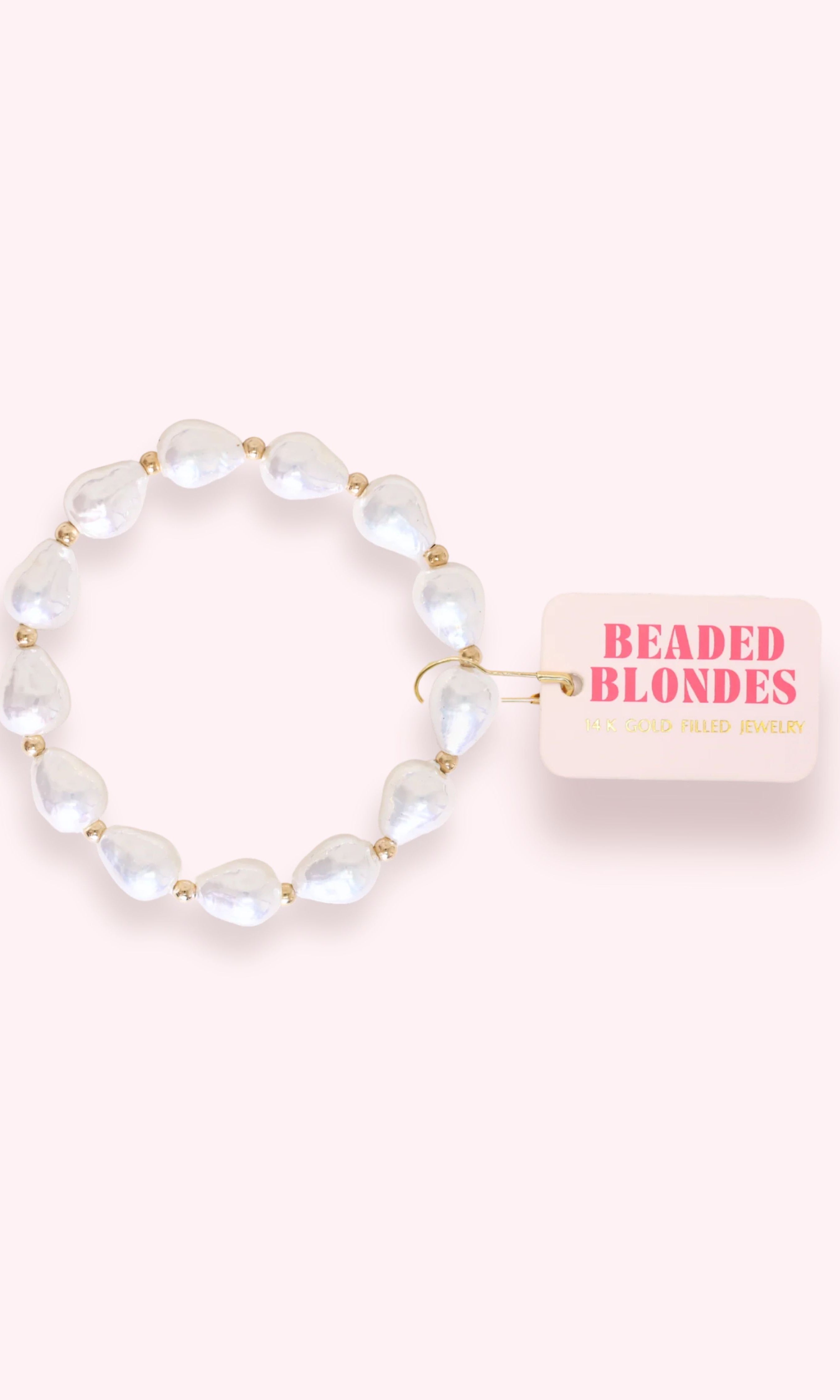 Beaded bracelet with a pink card labeled 'Beaded Blondes' on a white background