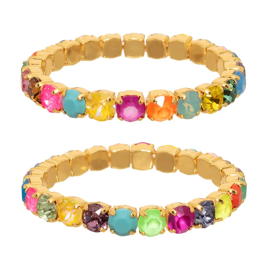 Gold bracelet with multicolored gemstones on a white background