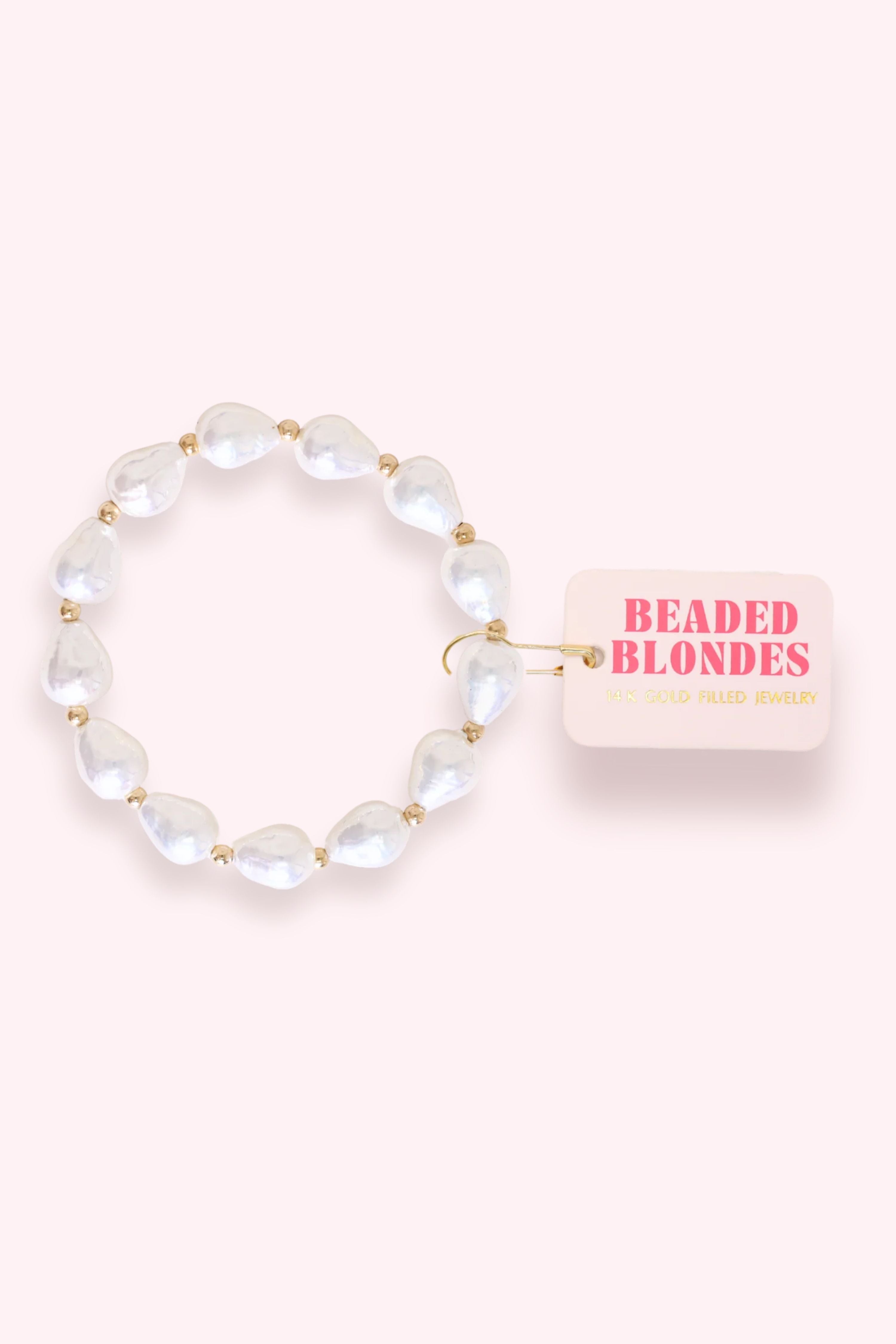 Beaded bracelet with a pink card labeled 'Beaded Blondes' on a white background
