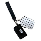 Black pouch with a strap and polka dot pouch on a white background